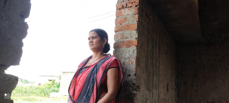 Smita at her half-constructed house under the PMAY scheme 