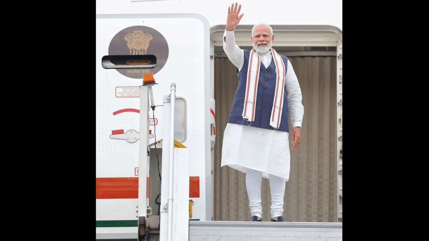 Prime Minister Narendra Modi waves while leaving for his visit to USA, in New Delhi, Tuesday, June 20. 2023. 