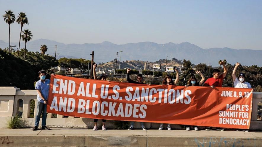 Activists in Los Angeles, California hold banner against sanctions ahead of the OAS Summit of the Americas and the counter People's Summit for Democracy. Photo: Midia Ninja