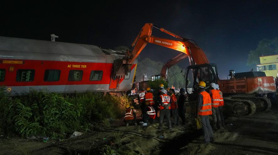 Rescue team members during a search operation after the accident involving three trains that claimed at least 261 people and left over 900 injured, in Balasore district, Odisha, Saturday, June 3, 2023. 