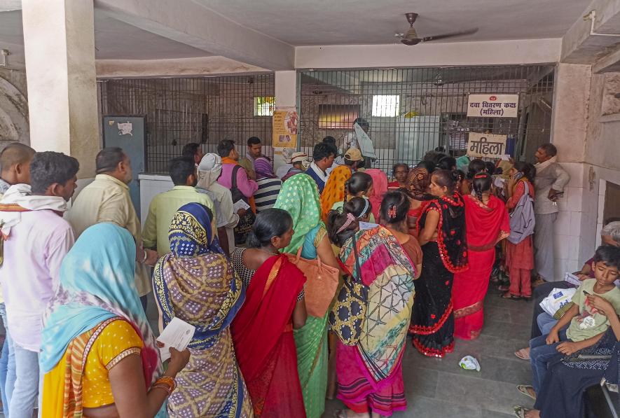 Family members of patients admitted at a hospital due to heatwave conditions, in Ballia, Sunday, June 18, 2023.