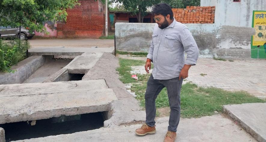 Ashish Tiwari of Gurujal explains how waste water after being treated is allowed to flow into the pond (Photo - Deepanwita Gita Niyogi, 101Reporters
