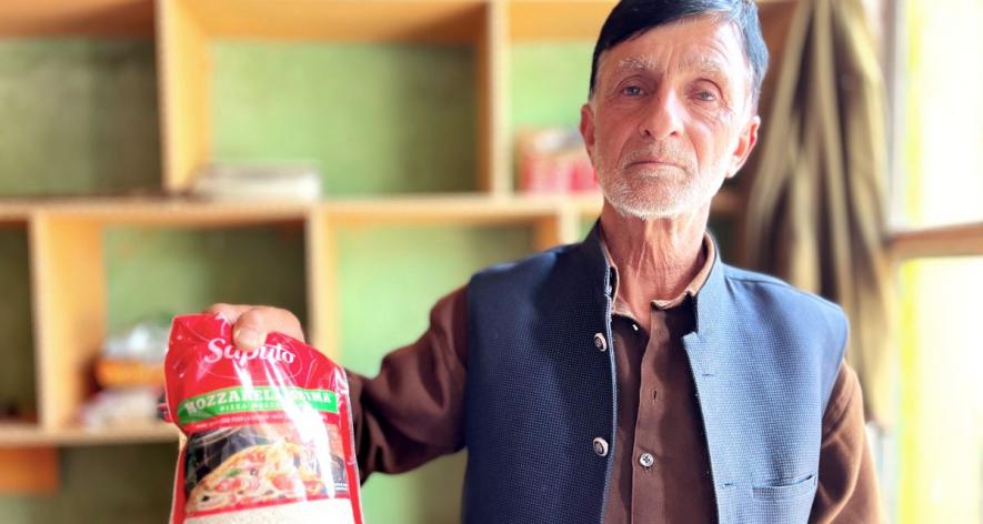 Farmer Abdul Rashid showing packed Mushk Budji (Photo - Khalid Gul, 101Reporters).