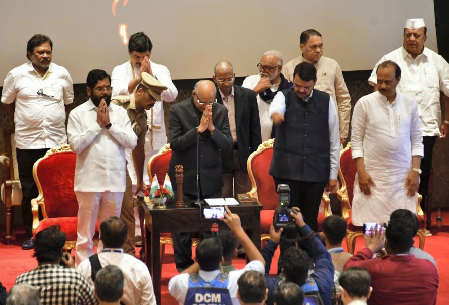 Maharashtra Governor Ramesh Bais with Chief Minister Eknath Shinde, Deputy Chief Ministers Devendra Fadnavis and Ajit Pawar, and newly sworn-in State Cabinet ministers during a ceremony at Raj Bhavan, in Mumbai, Sunday, July 2, 2023.