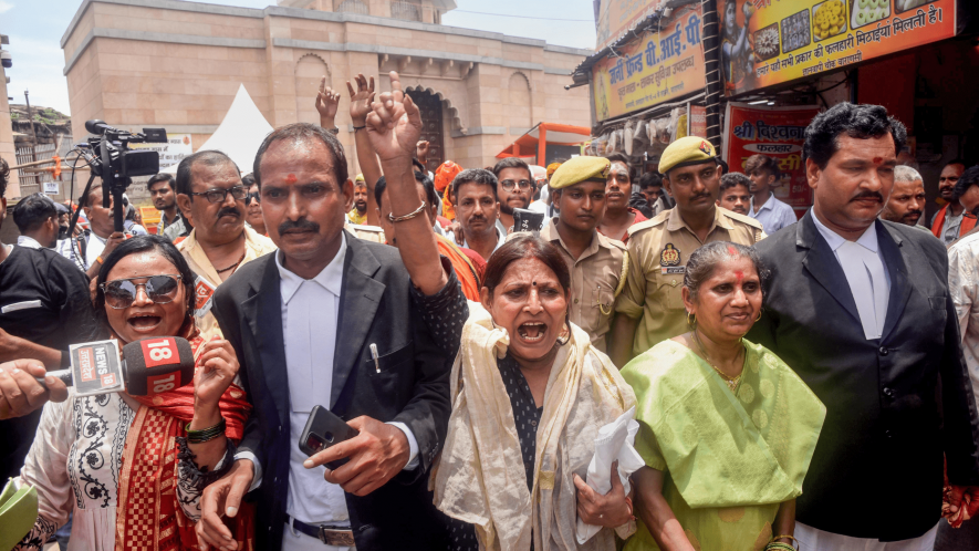 Advocates and petitioners from the Hindu side in the Gyanvapi mosque-Shringar Gauri case raise slogans as they come out of the mosque premises, in Varanasi, Monday, July 24, 2023.