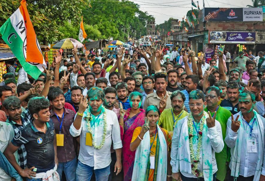 Trinamool Congress Zila Parishad candidate Kajal Sheikh with winning candidates of gram panchayat and panchayat samiti shows victory signs after the announcement of their result in the Panchayat elections outside a counting centre, in Birbhum district, Tuesday, July 11, 2023. 