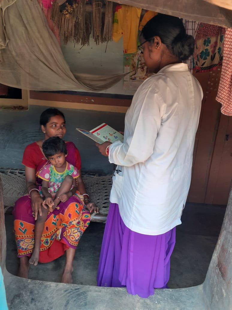 ASHA worker Malati Hembram routine visits the house of Mamani Hembram in Bagdubi village, Ranibandh to check the health of the mother and child
