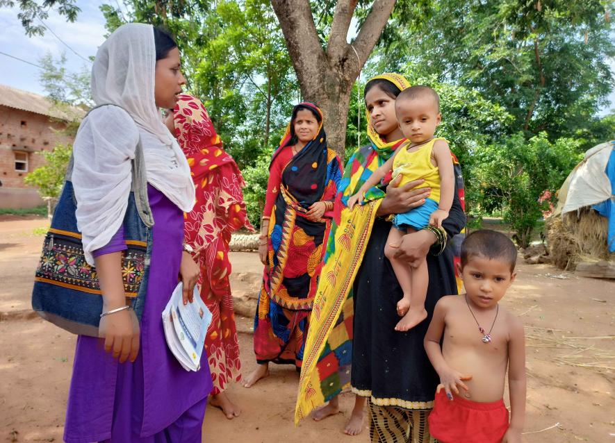 2.ASHA worker Jahima Khatun is checking the health of mother and child at punisol village, onda