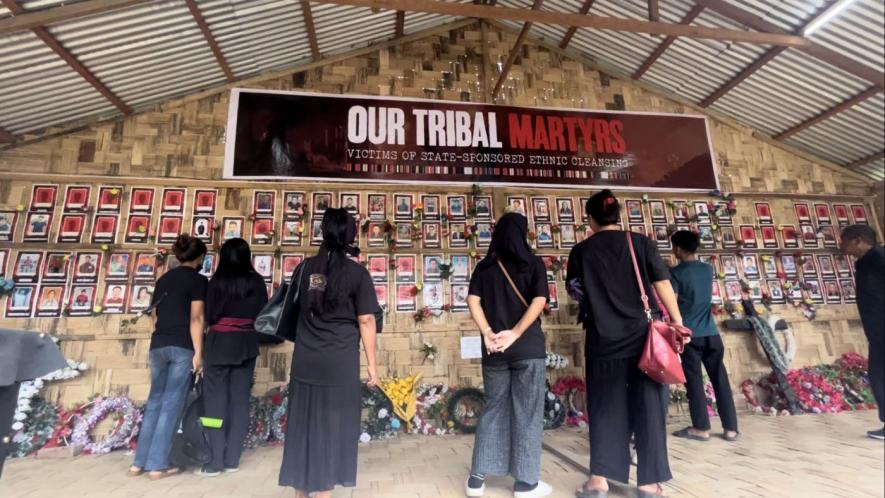 Visitors at the ‘Wall of Remembrance’ set up in the memory of people of the Kuki-Zo community who lost lives in the violence.