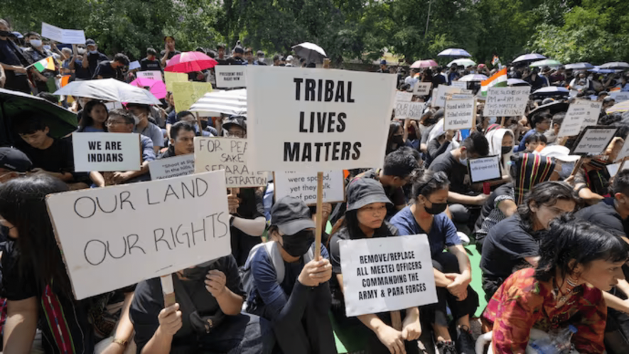 Tribal people of Manipur take part in a ‘Tribal Solidarity protest’ against the ongoing tension in the state, at Jantar Mantar, in New Delhi (PTI Photo/File)