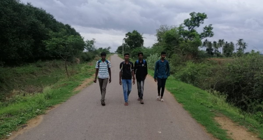 Students of Bommanahal Junior College return to their native village of Devagiri, Andhra Pradesh, after the bus was late.