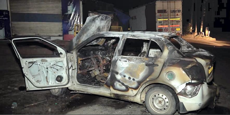 Wreckage of a vehicle that was set on fire during clashes between two groups, at Sohna in Gurugram district, Tuesday, Aug 1, 2023. The clashes erupted following an attempt to stop a VHP procession in nearby Nuh district which spread to Gurugram district.