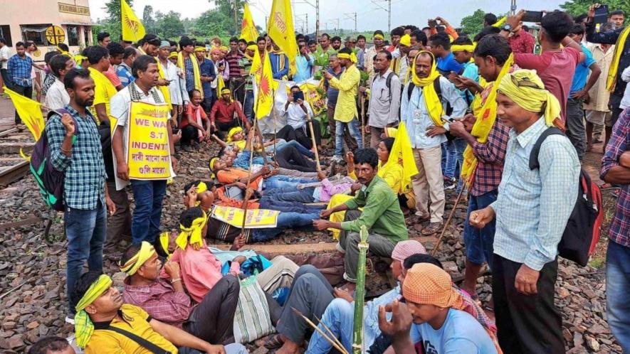 Agitators from the Kurmi community block railway tracks to press for their demand for Scheduled Tribe (ST) status, in West Medinipur district, Wedneday, Sept. 21, 2022.