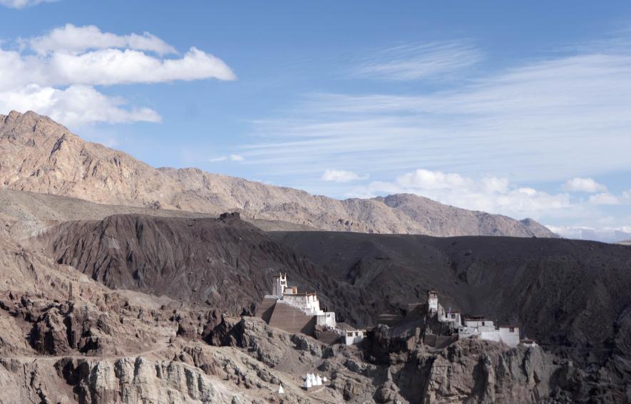 Glimpse of a monastery and a picturesque landscape.