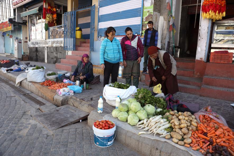 Woman from nearby villages travel daily to Leh city market to sell their vegetables and produce.