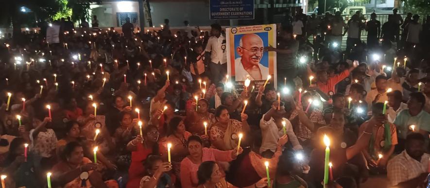 Teachers light candles in protest on Gandhi Jayanti on Oct 2.