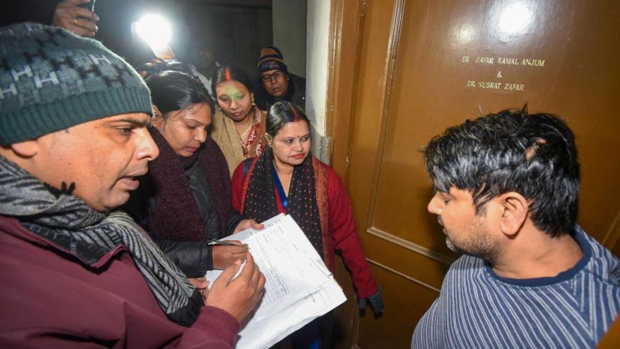 Enumerators receive information from a Patna resident during a caste-based survey in Bihar.