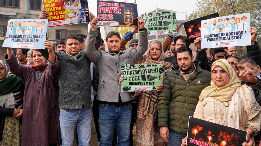  Congress leaders and workers raise slogans during a protest over unscheduled power cuts, in Srinagar, Thursday, Nov. 23, 2023