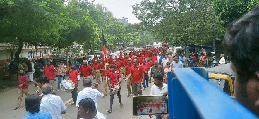 Red volunteers leading the funeral procession.