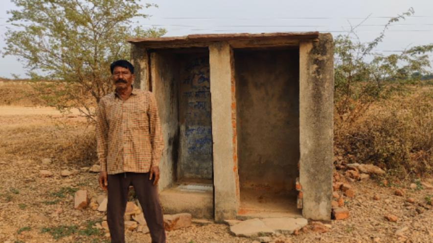 Mangi Lal, a Dalit resident of Mandsaur’s Panch Khaira village, outside the toilet constructed around six years ago. The toilet has no septic tank.