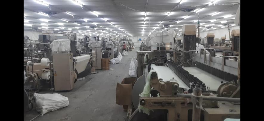 Inside the textile operations that clearly show how there are much more machines than the labour available.