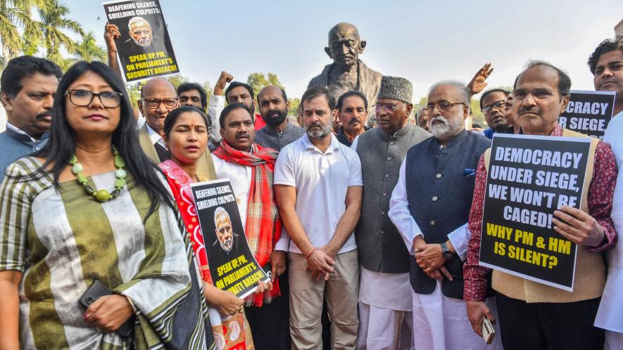 Congress MPs Mallikarjun Kharge and Rahul Gandhi with suspended Opposition MPs during a protest at Mahatma Gandhi statue during the Winter session of Parliament, in New Delhi, Tuesday, Dec. 19, 2023.