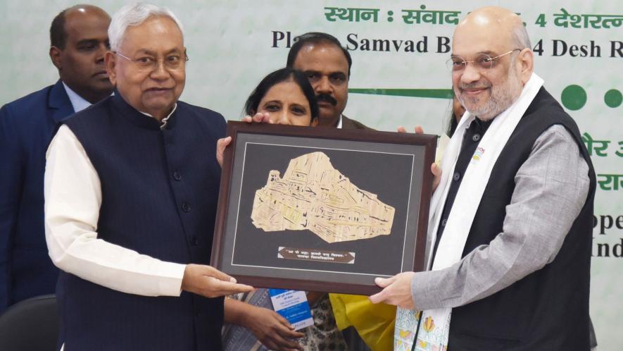 Union Home Minister Amit Shah being presented a memento by Bihar Chief Minister Nitish Kumar during the 26th meeting of Eastern Zonal Council, in Patna, Sunday, Dec. 10, 2023.