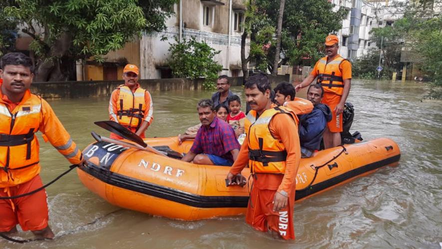 NDRF personnel evacuate residents from a waterlogged area after heavy rainfall owing to Cyclone Michaung, in Kanchipuram, Tuesday, Dec. 5, 2023.