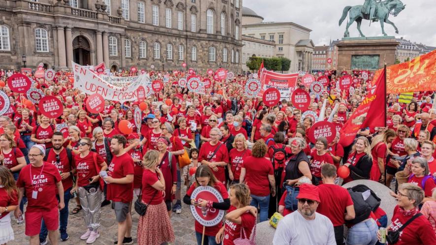 Nurses’ protest at the Christiansborg Castle Square, Copenhagen in 2021 demanding pay rises. The strike was one of several which have occurred across Europe in recent years to protest conditions in the sector. (Photo: via Danish Nurses' Organization)