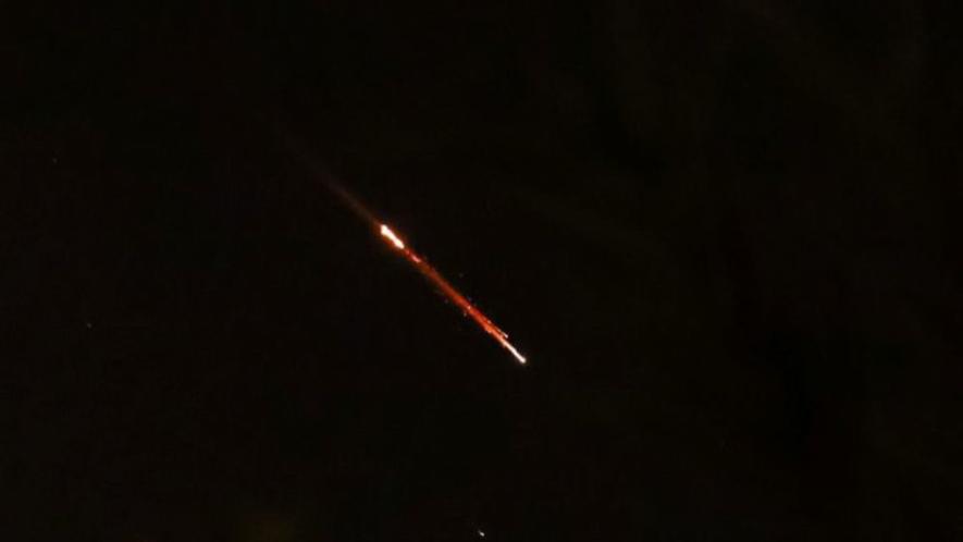 Objects lighting up the sky above Jerusalem after Iran launched drones and missiles towards Israel, April 13, 2024