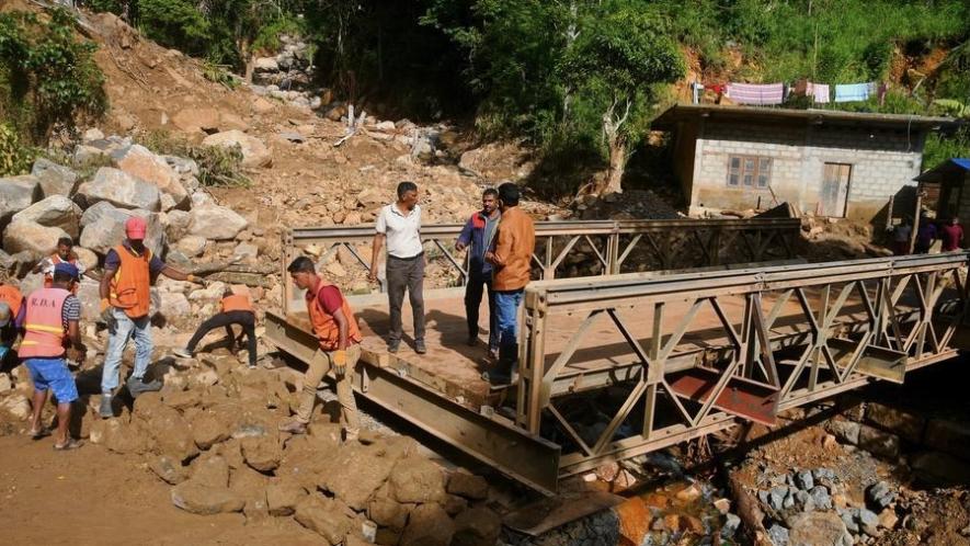 People repair a collapsed bridge affected by Cyclone Ditwah in Badulla District, Sri Lanka, Dec. 13, 2025. Photo: Xinhua