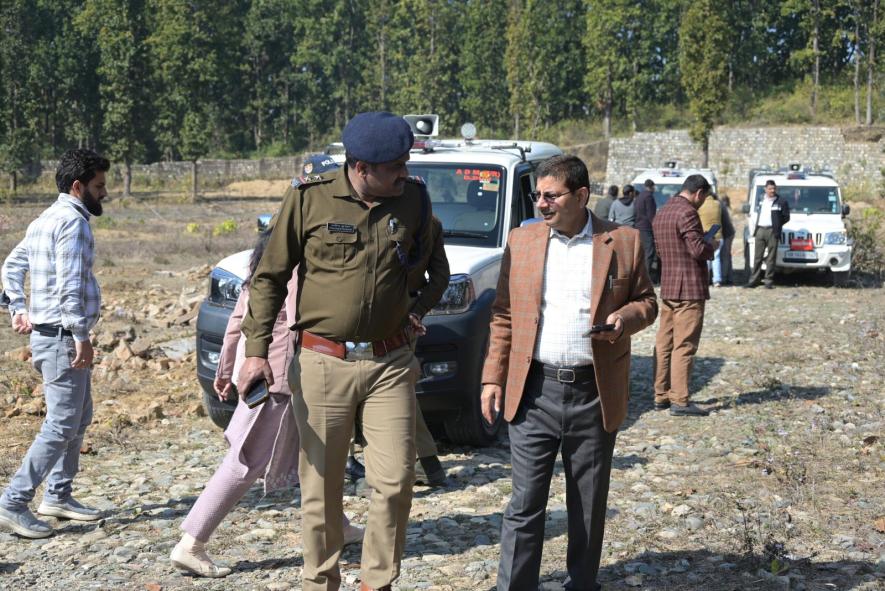 Team of administrative officials at the land which BJP claimed was to be used to built a Muslim University in Dholas village in Dehradun west.