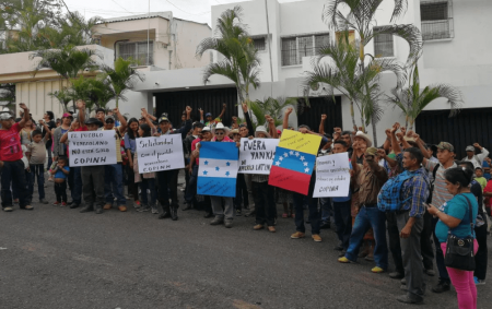 Members of COPINH of Honduras stand in solidarity with Venezuela.
