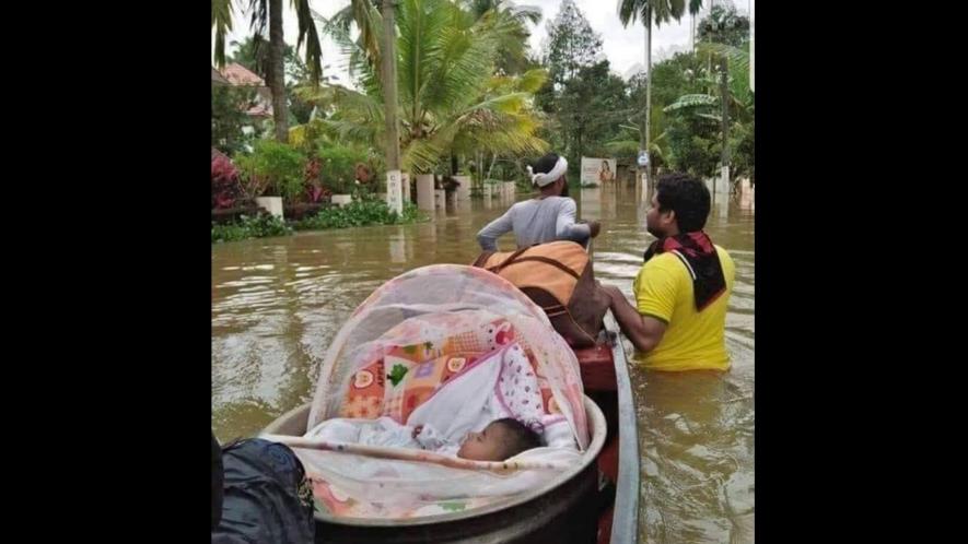 Baby rescued by fishermen during Kerala floods